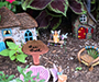 Whimsical tiny houses in a garden setting